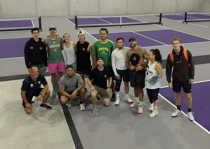Group of pickleball players together on the courts at Pickleball Park NZ